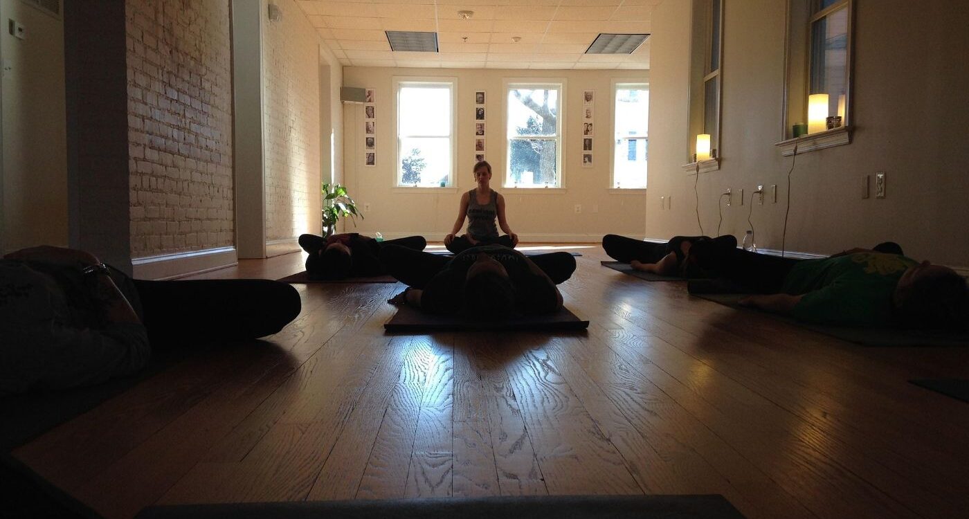 Students lying on floor on Yoga mats - Small Steps Will Quietly Lead You to the Summit of Meditation