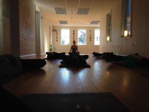 Students lying on floor on Yoga mats - Small Steps Will Quietly Lead You to the Summit of Meditation