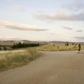 Three people walking down the Way of St. James trail - Life’s Pilgrimage: Journeying Towards Our Spiritual Home
