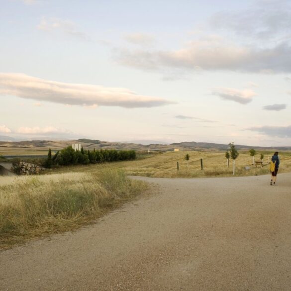 Three people walking down the Way of St. James trail - Life’s Pilgrimage: Journeying Towards Our Spiritual Home