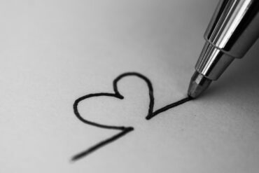Black pen drawing heart on white paper - Mindfulness and Art: The Value of Small Repetitive Movements